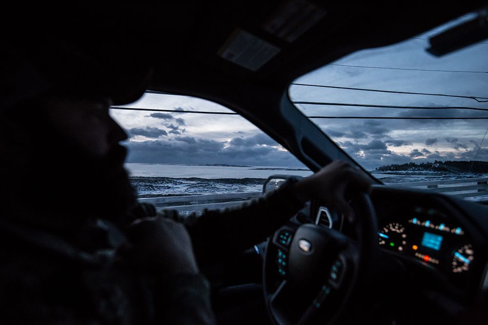 Man in truck driving in the early morning to the duck hunt