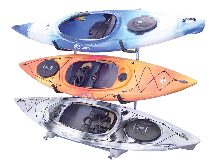 Three kayaks on a free standing rack with a white background
