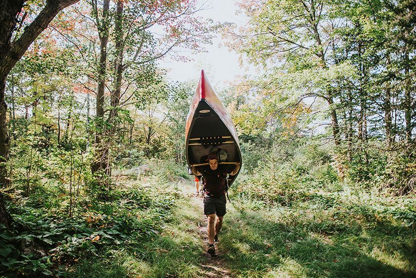 Portaging a canoe in Katahdin Woods & Waters National Monument 