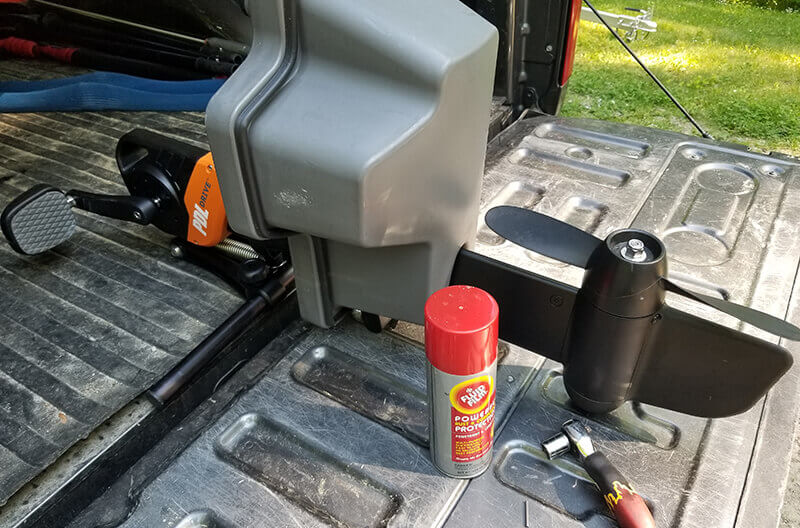 A PDL Drive on a tailgate with anti-corrosion spray and a ratchet demonstrating proper drive maintenance.