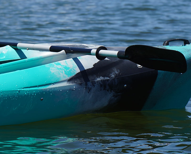 Carlisle Day Tripper 2 Piece paddle resting on paddle rest on top of Old Town Vapor kayak