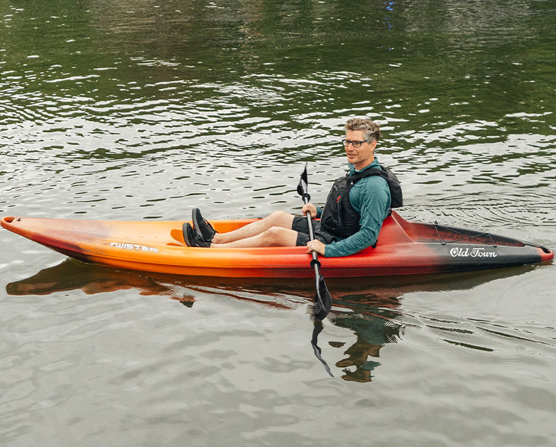 Man paddling in the Old Town Twister recreational kayak on the water