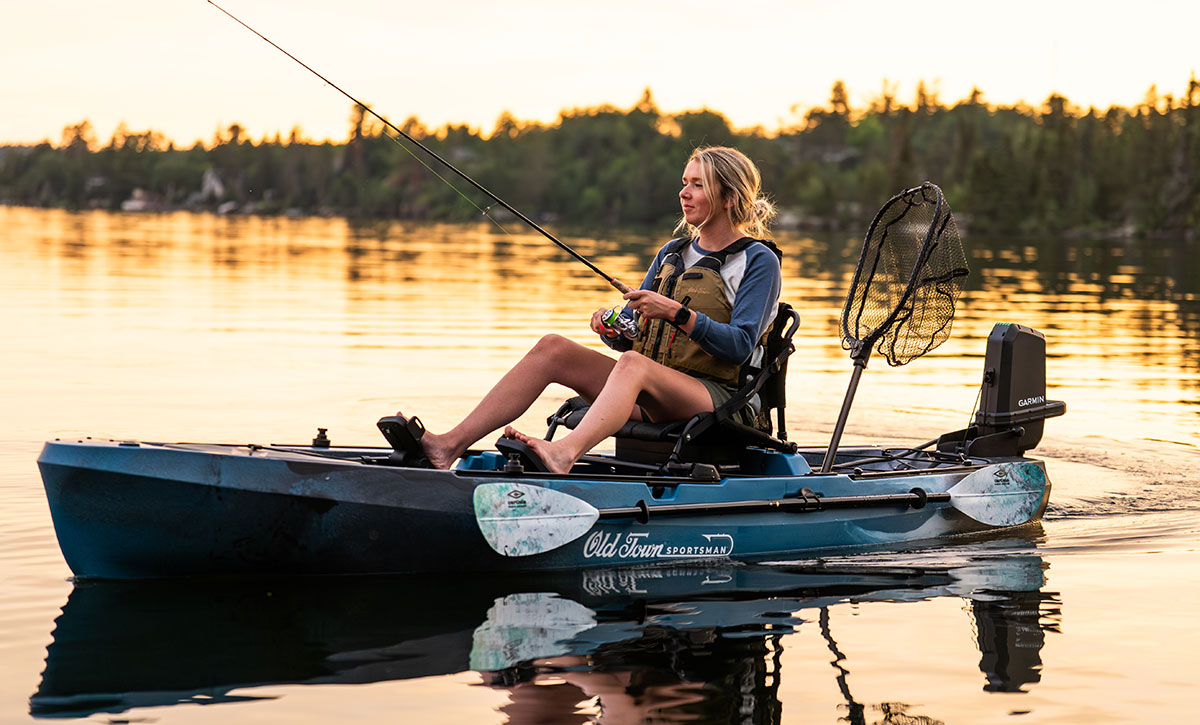 Woman fishing in the Old Town Sportsman 120 PRO fishing kayak
