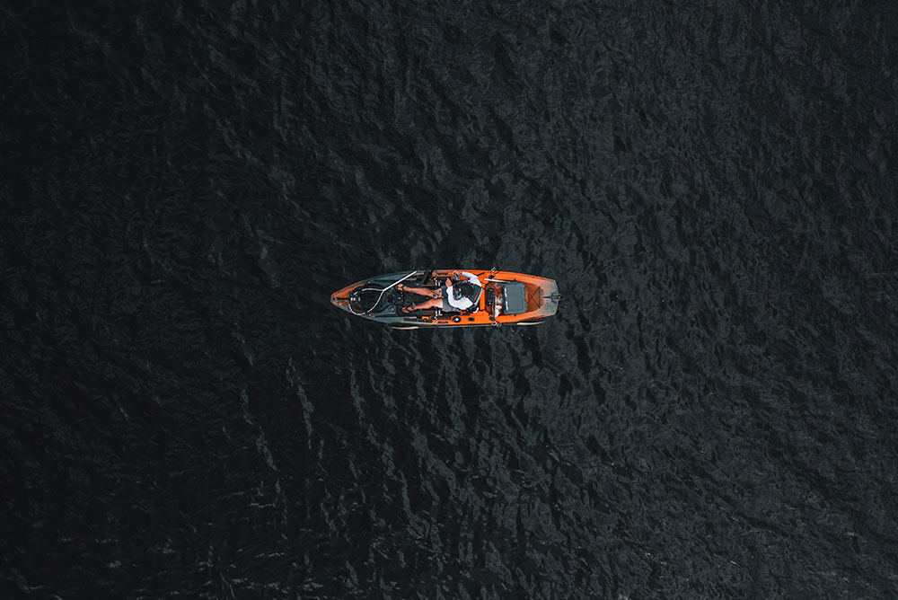 Top down view of man in Old Town Sportsman fishing kayak