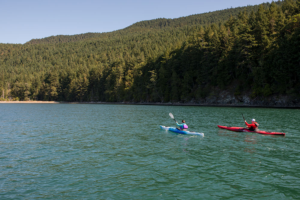 Two paddlers in Old Town Touring Kayaks