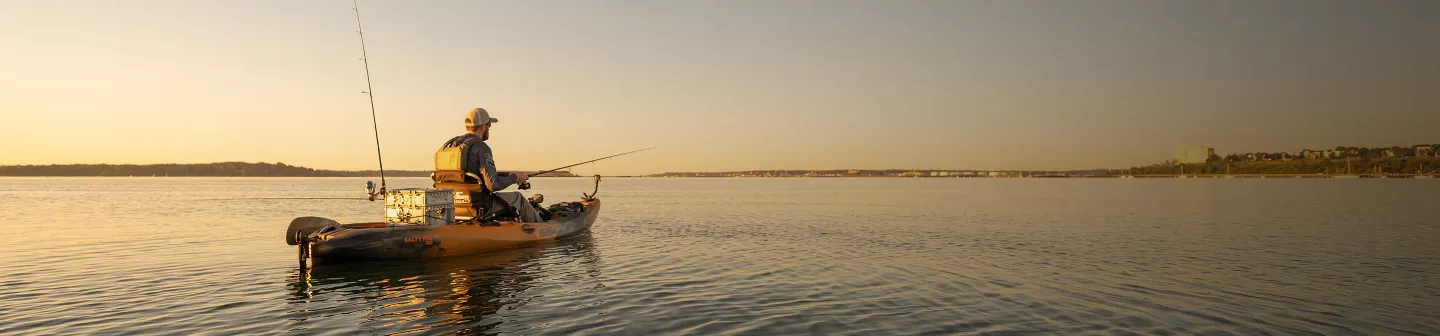 A kayak angler at sunrise