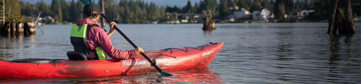 Woman paddling in Old Town Kayak