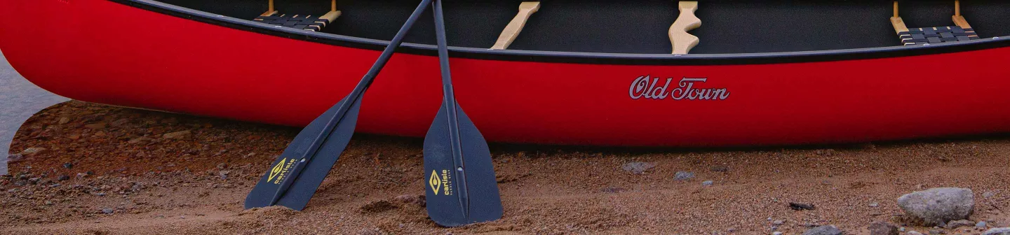 Carlisle Canoe Paddles in front of Old Town Canoe