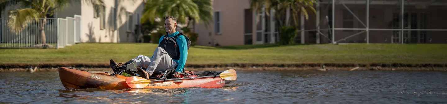 Man pedaling in the Old Town Ocean Kayak Malibu ePDL+ 120