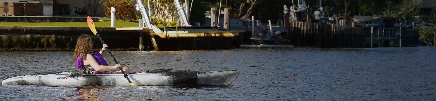 Woman paddling in the Old Town Loon 120 recreational kayak