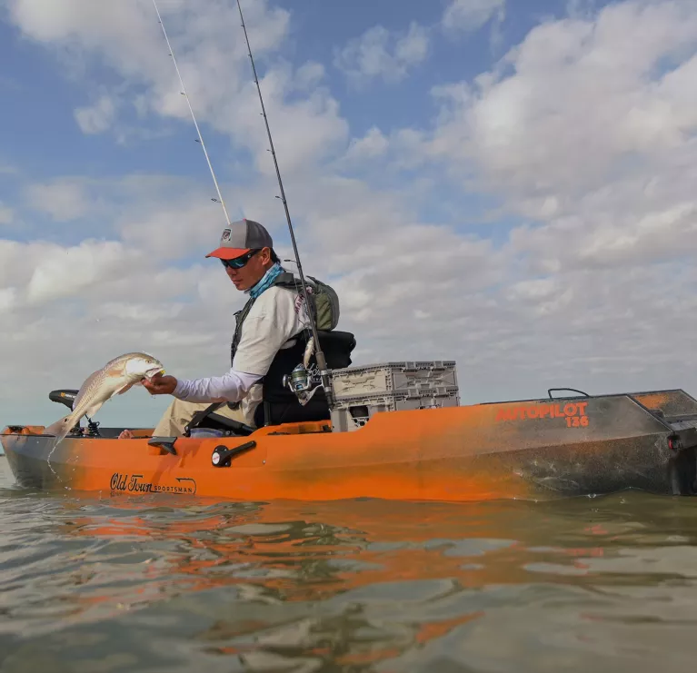 Standing up fishing in the Old Town Sportsman AutoPilot 120 fishing kayak