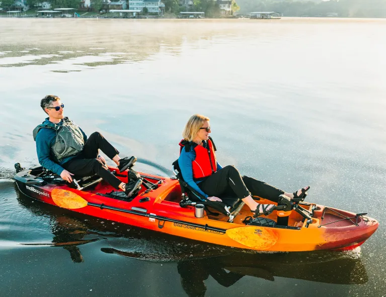 Couple pedaling on the Old Town Ocean Kayak Malibu Pedal T recreational kayak