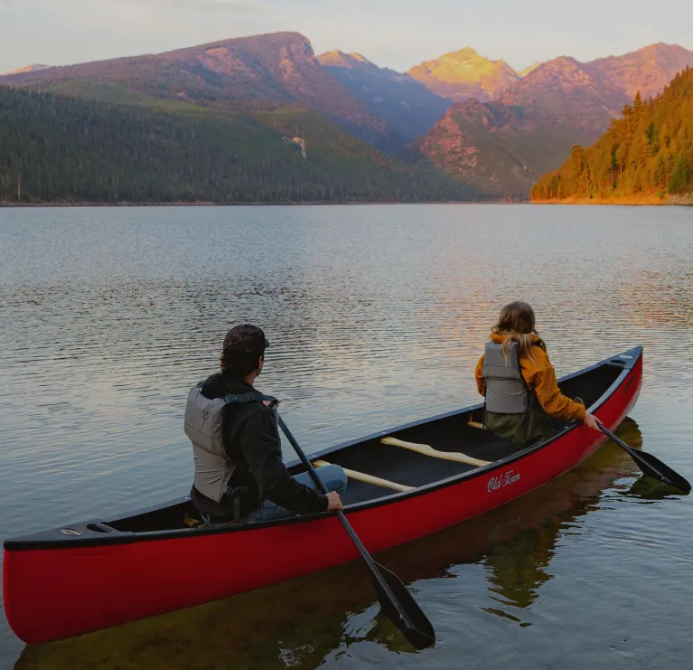 Couple paddling in the Old Town Discovery 169 canoe