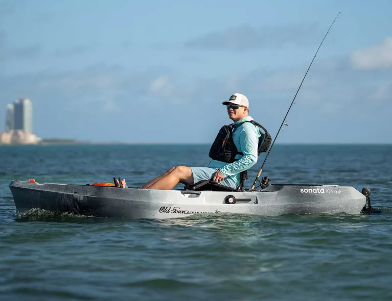 Man relaxing on the water in the Old Town Ocean Kayak Sonata 106 MK recreational kayak