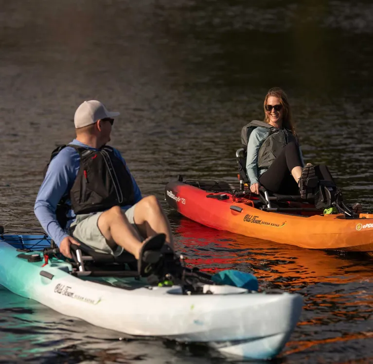 Two happily pedaling in the Old Town Ocean Kayak Malibu ePDL+ 120 recreation kayak