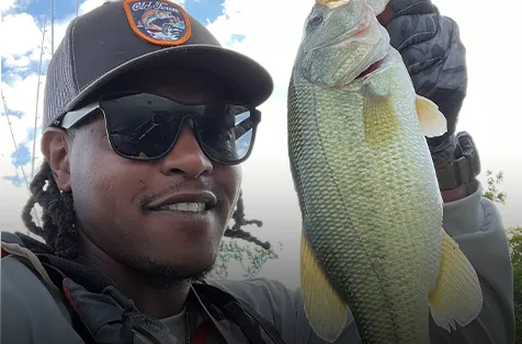 Antoine Hayes holding a largemouth bass