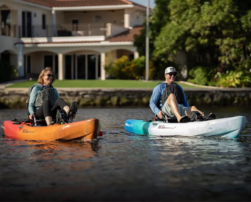 Two people pedaling in Old Town Ocean Kayak Malibu ePDL+ 120 kayaks